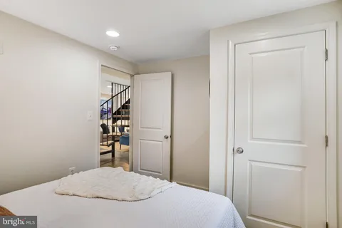 a bedroom with a bed and a closet