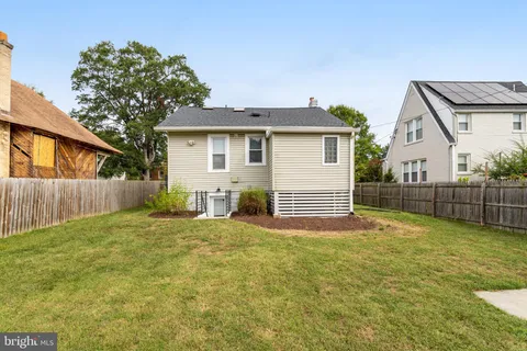a view of a backyard of the house