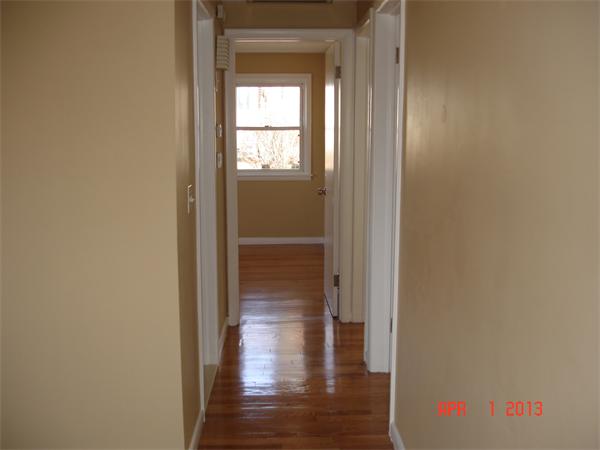 297 West Allen Ridge Road Springfield, MA 01118 - Photo 6 of 18 a view of a hallway with wooden floor