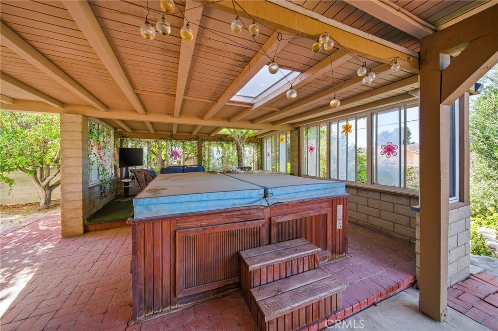 19670 Tonkawan Road Apple Valley, CA 92307 - Photo 47 of 70 Covered Spa with skylight and Seating area of Arizona Room