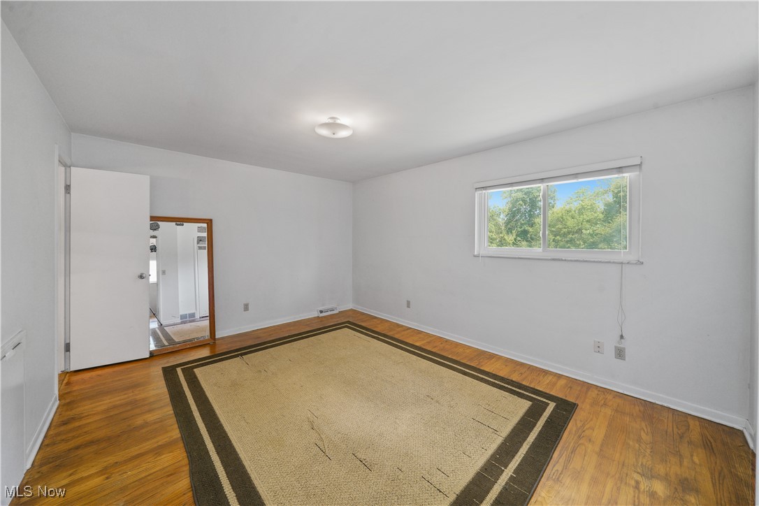 515 Ridge Road Hinckley, OH 44233 - Photo 10 of 21 Unfurnished room with hardwood / wood-style floors