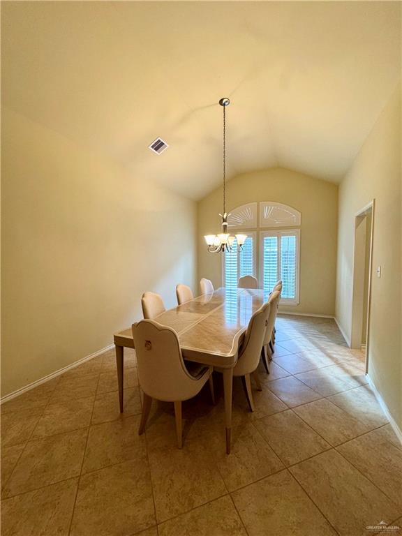 2911 San Rafael Street Mission, TX 78572 - Photo 16 of 38 a view of a dining room with furniture and chandelier