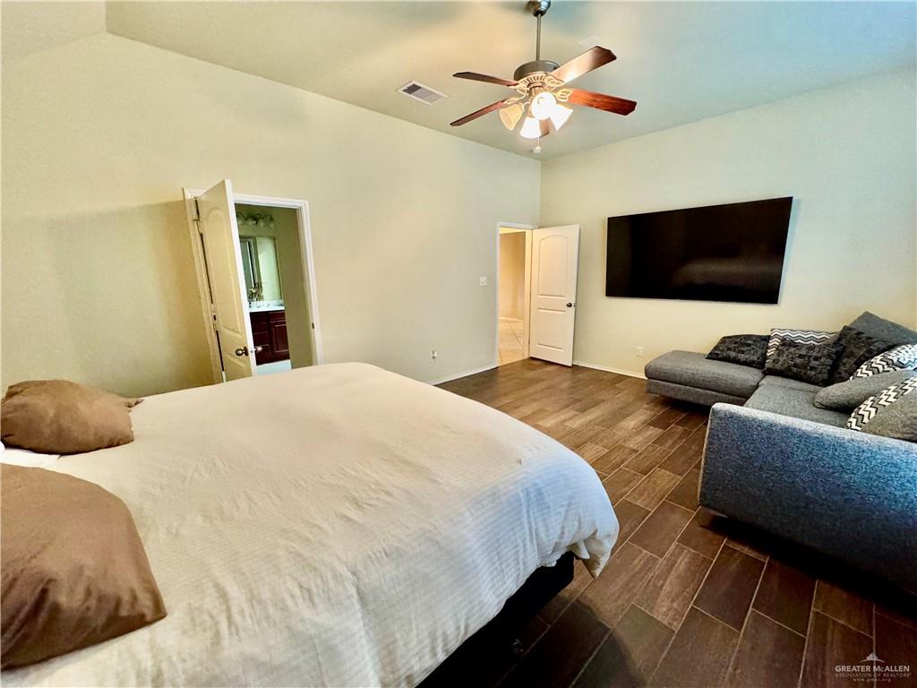 2911 San Rafael Street Mission, TX 78572 - Photo 19 of 38 a bedroom with a bed and a flat screen tv