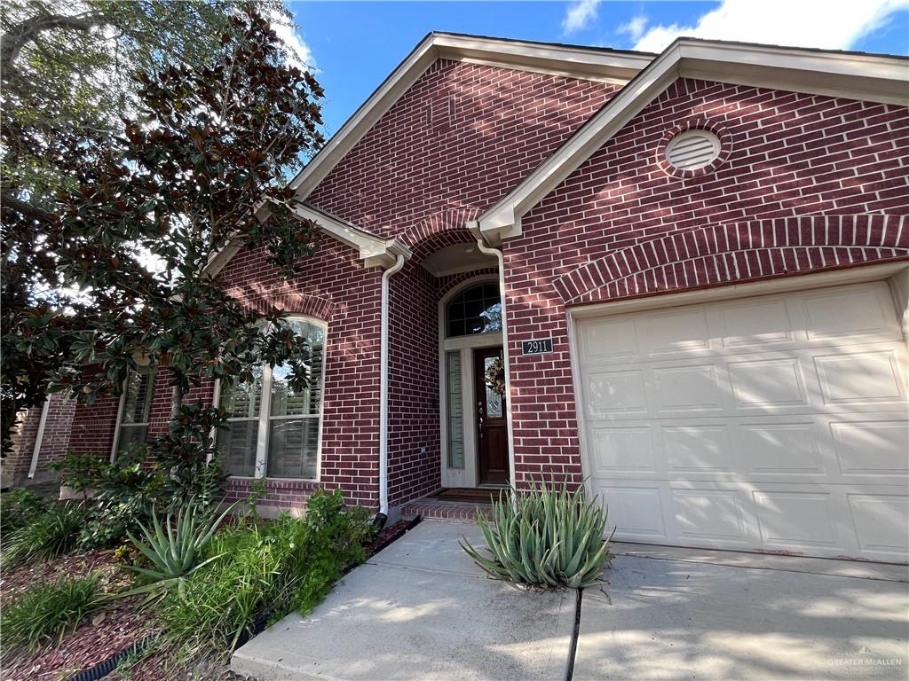 2911 San Rafael Street Mission, TX 78572 - Photo 2 of 38 a front view of a house with a garden