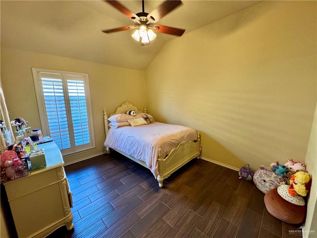 2911 San Rafael Street Mission, TX 78572 - Photo 23 of 38 a bedroom with a bed and wooden floor
