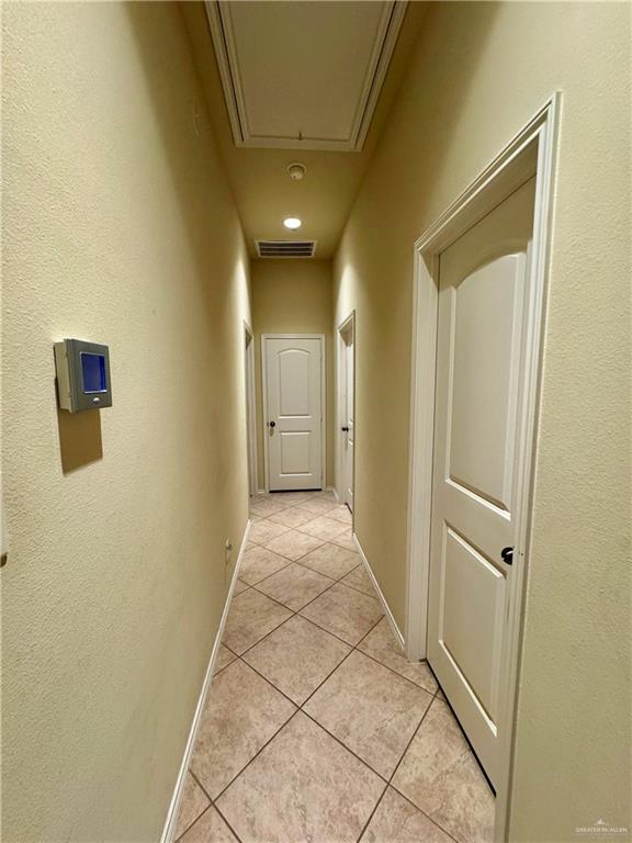 2911 San Rafael Street Mission, TX 78572 - Photo 27 of 38 a view of a hallway with wooden shelves