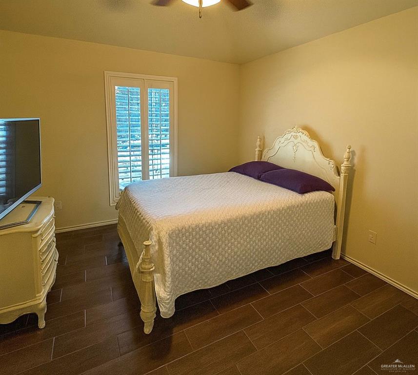 2911 San Rafael Street Mission, TX 78572 - Photo 32 of 38 a bed sitting in a bedroom next to a window