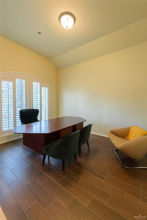 2911 San Rafael Street Mission, TX 78572 - Photo 6 of 38 a view of a workspace with furniture and a potted plant