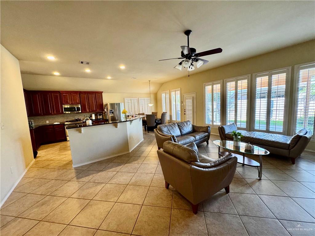 2911 San Rafael Street Mission, TX 78572 - Photo 8 of 38 a living room with patio furniture kitchen view and a large window