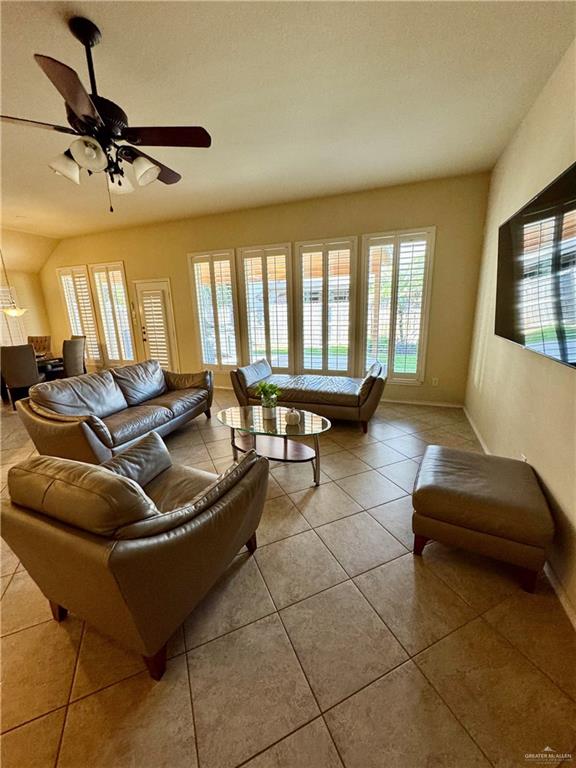 2911 San Rafael Street Mission, TX 78572 - Photo 9 of 38 a living room with couches and furniture with a flat screen tv
