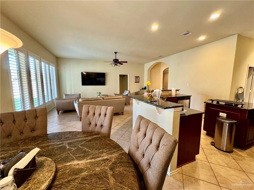 2911 San Rafael Street Mission, TX 78572 - Photo 10 of 38 a living room with furniture and a flat screen tv