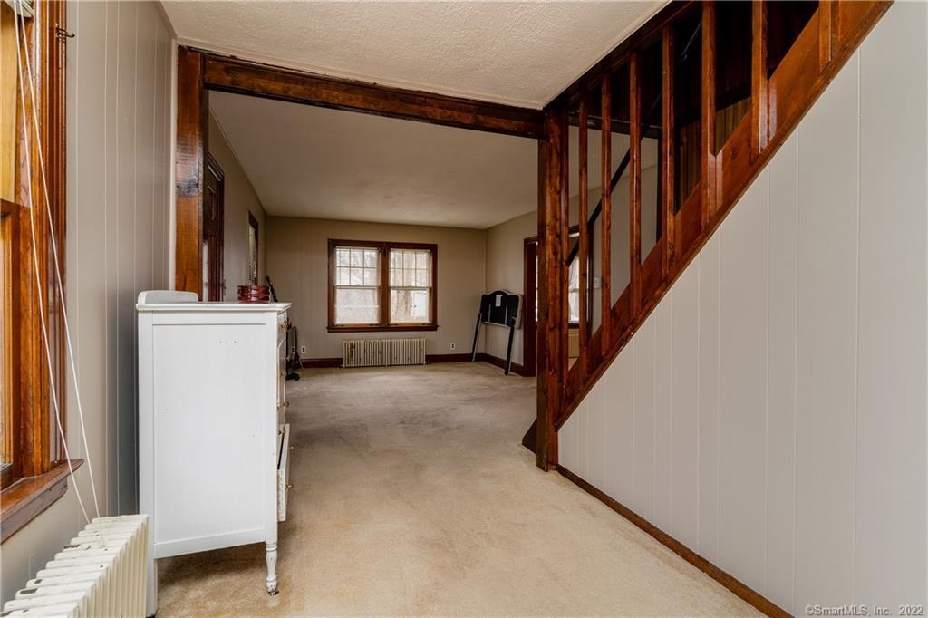 25 Pickett District Road New Milford, CT 06776 - Photo 22 of 34 a view of a hallway to an entryway with staircase