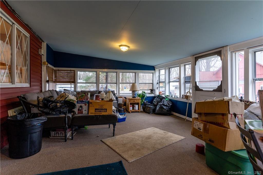 25 Pickett District Road New Milford, CT 06776 - Photo 28 of 34 a living room with furniture gym equipment and a large window