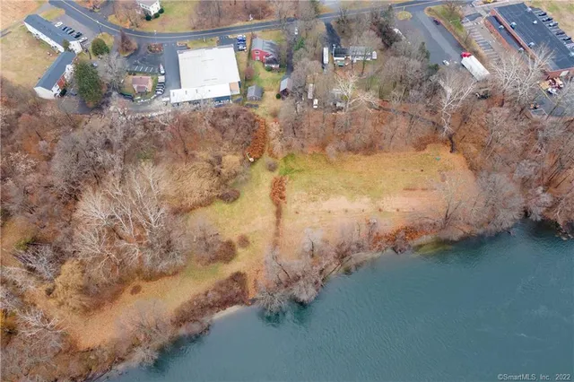 an aerial view of a house with outdoor space