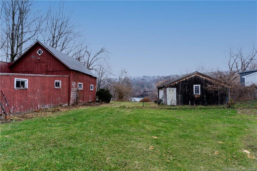 25 Pickett District Road New Milford, CT 06776 - Photo 31 of 34 a front view of a house with a yard