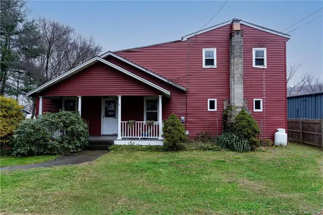 a aerial view of a house with a yard