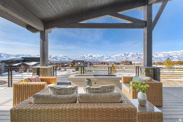 1282 Chimney Rock Road, Unit 344 Heber City, UT 84032 - Photo 14 of 55 Covered outdoor patio featuring exposed wood beams and stone column accents