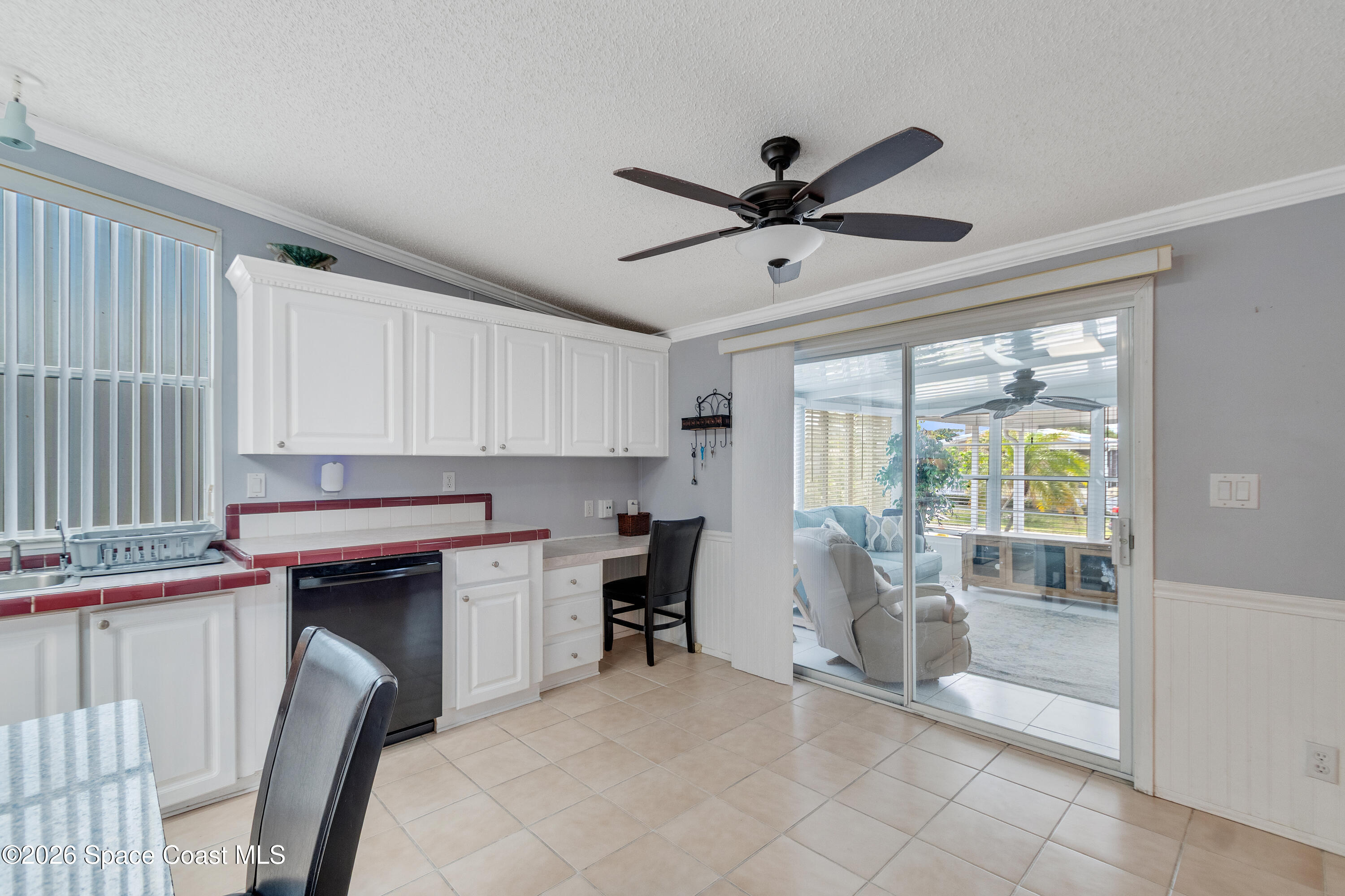 7669 Chasta Road Micco, FL 32976 - Photo 15 of 34 a kitchen with stainless steel appliances granite countertop a stove a sink and a refrigerator