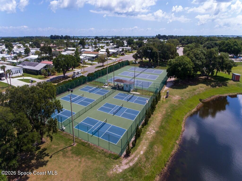 7669 Chasta Road Micco, FL 32976 - Photo 29 of 34 a view of a lake with a city