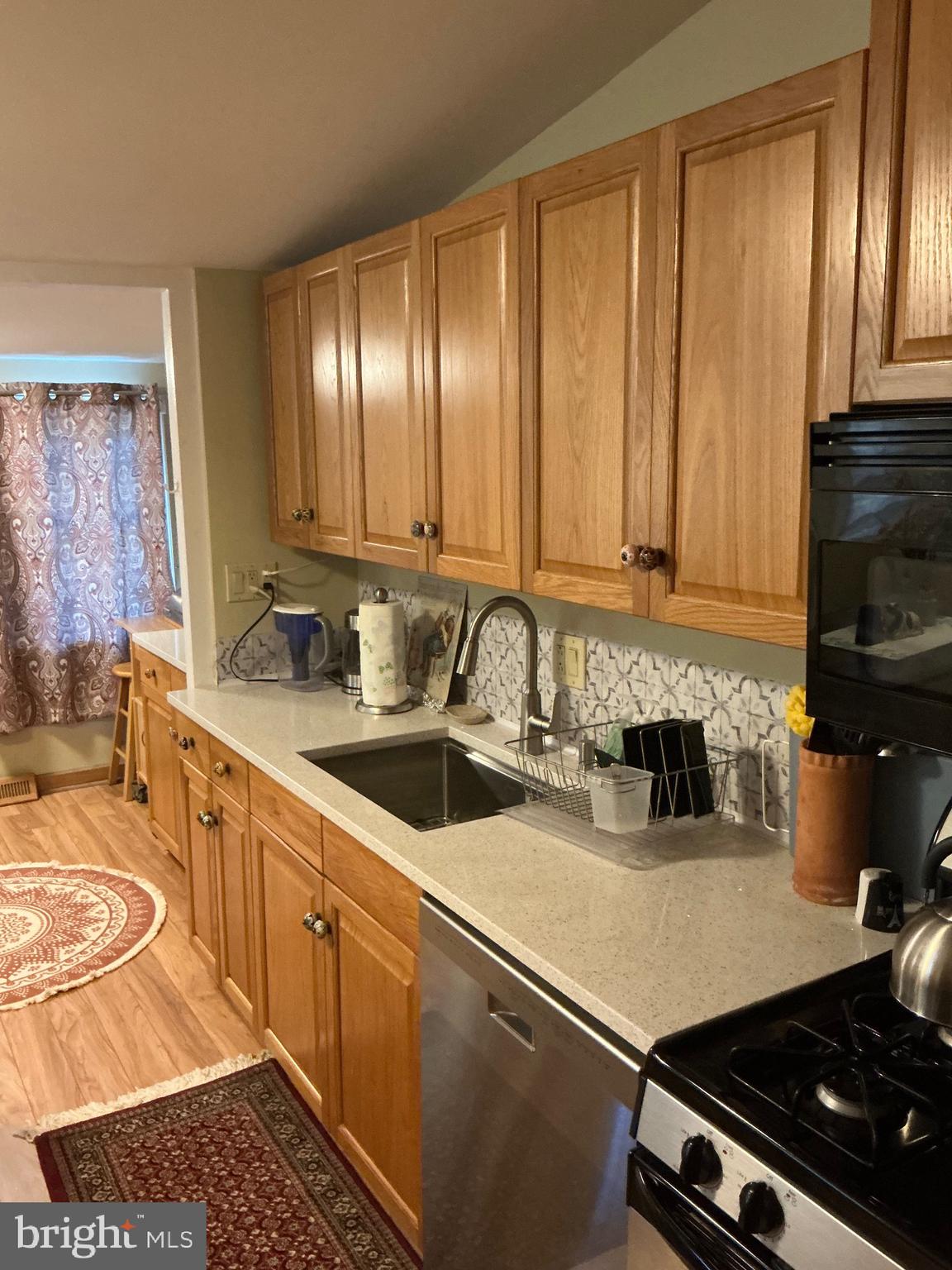 29 Centre Street Haddonfield, NJ 08033 - Photo 22 of 39 a kitchen with a sink stove and cabinets