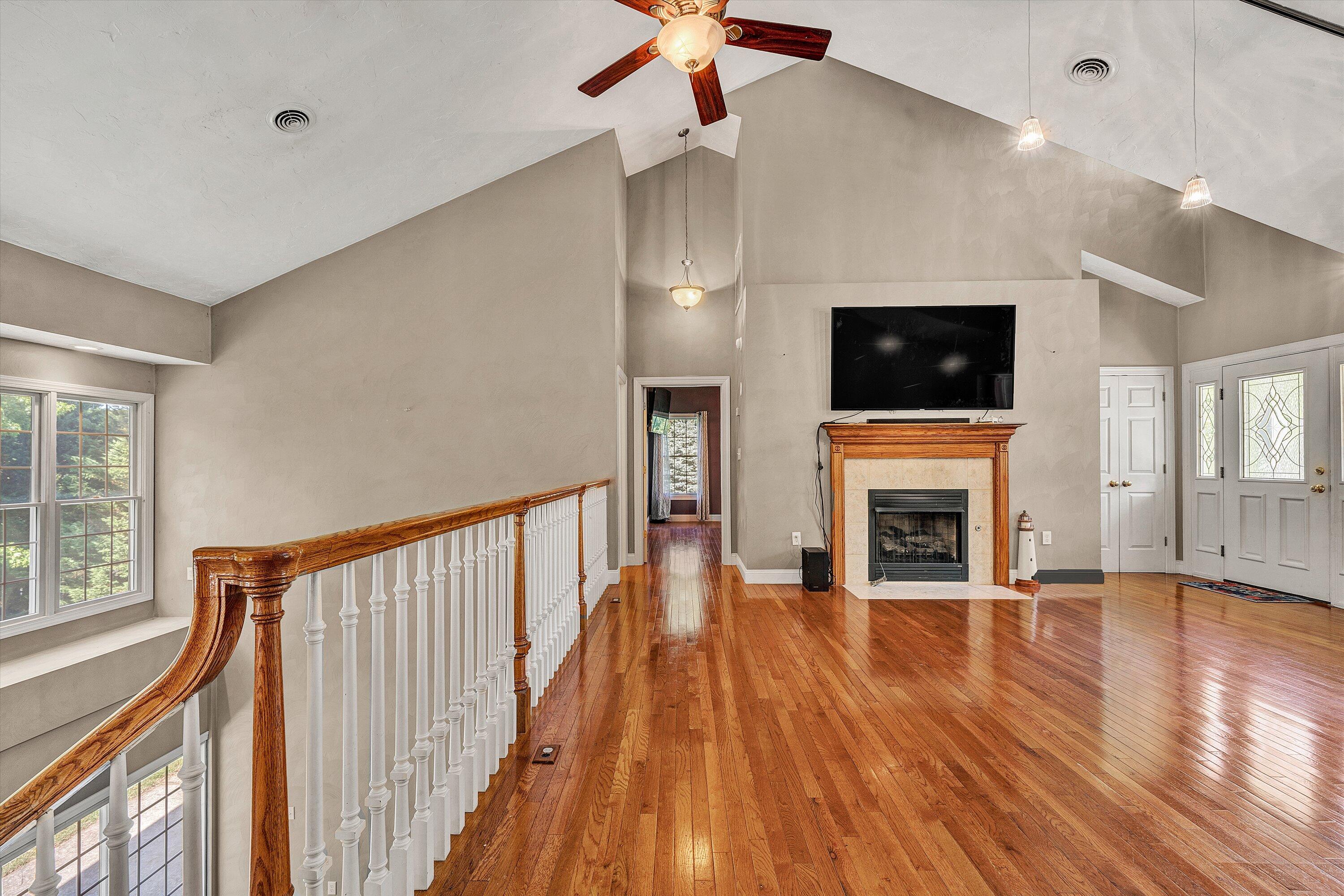 1805 Carroll Road Goodview, VA 24095 - Photo 11 of 61 a view of a livingroom with wooden floor and a fireplace
