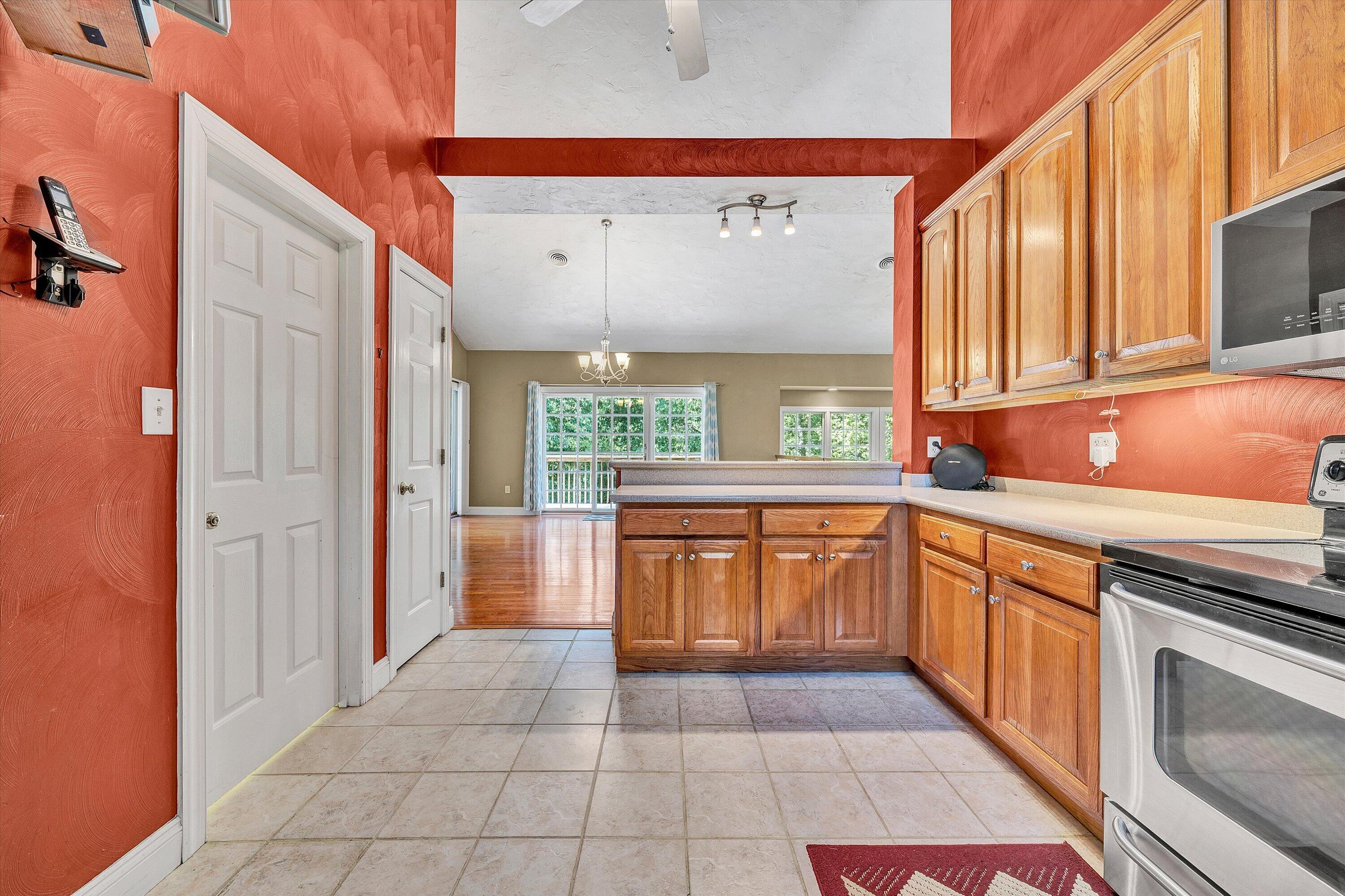1805 Carroll Road Goodview, VA 24095 - Photo 21 of 61 a kitchen with stainless steel appliances granite countertop a sink and a stove