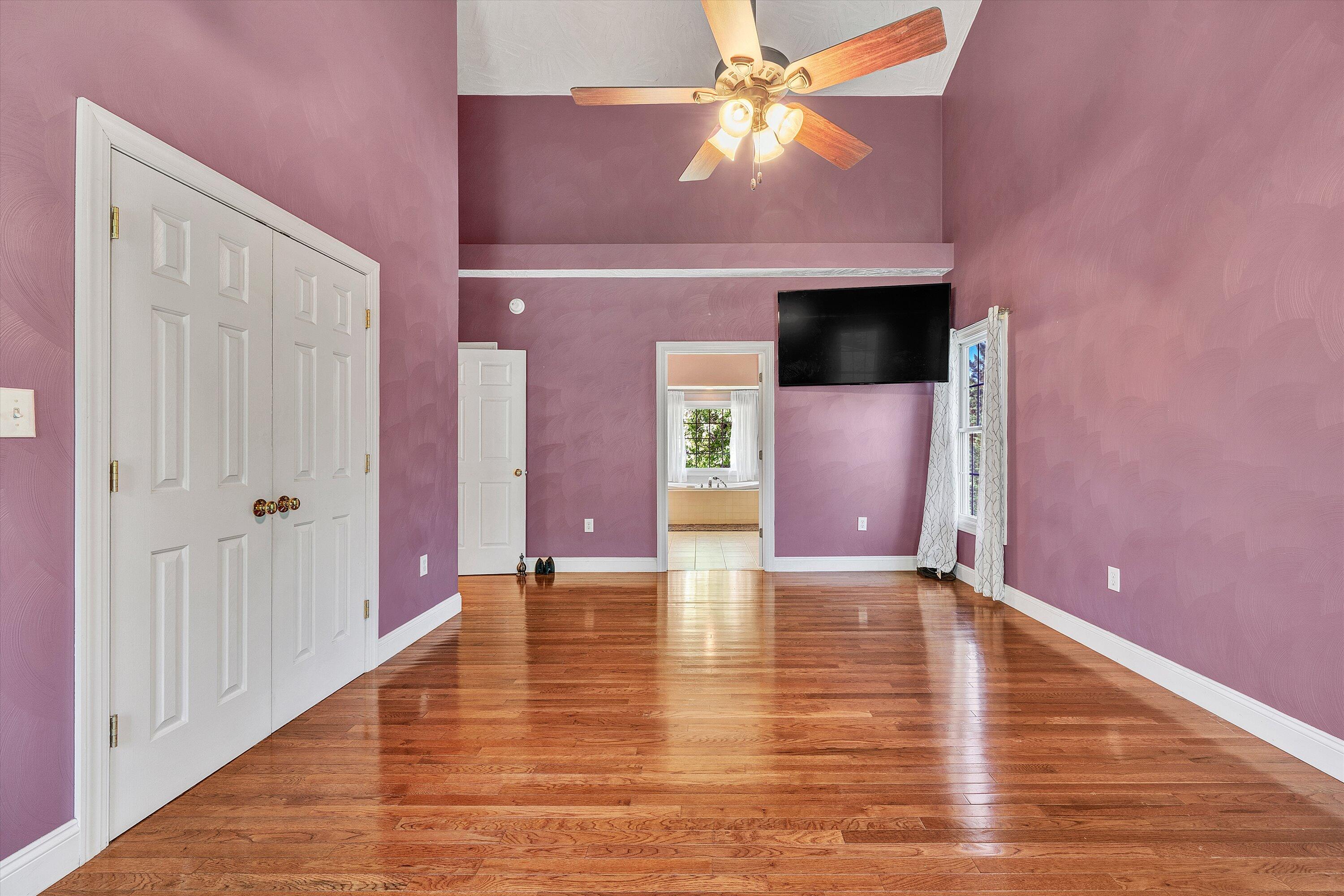 1805 Carroll Road Goodview, VA 24095 - Photo 26 of 61 a view of an empty room with wooden floor and a ceiling fan