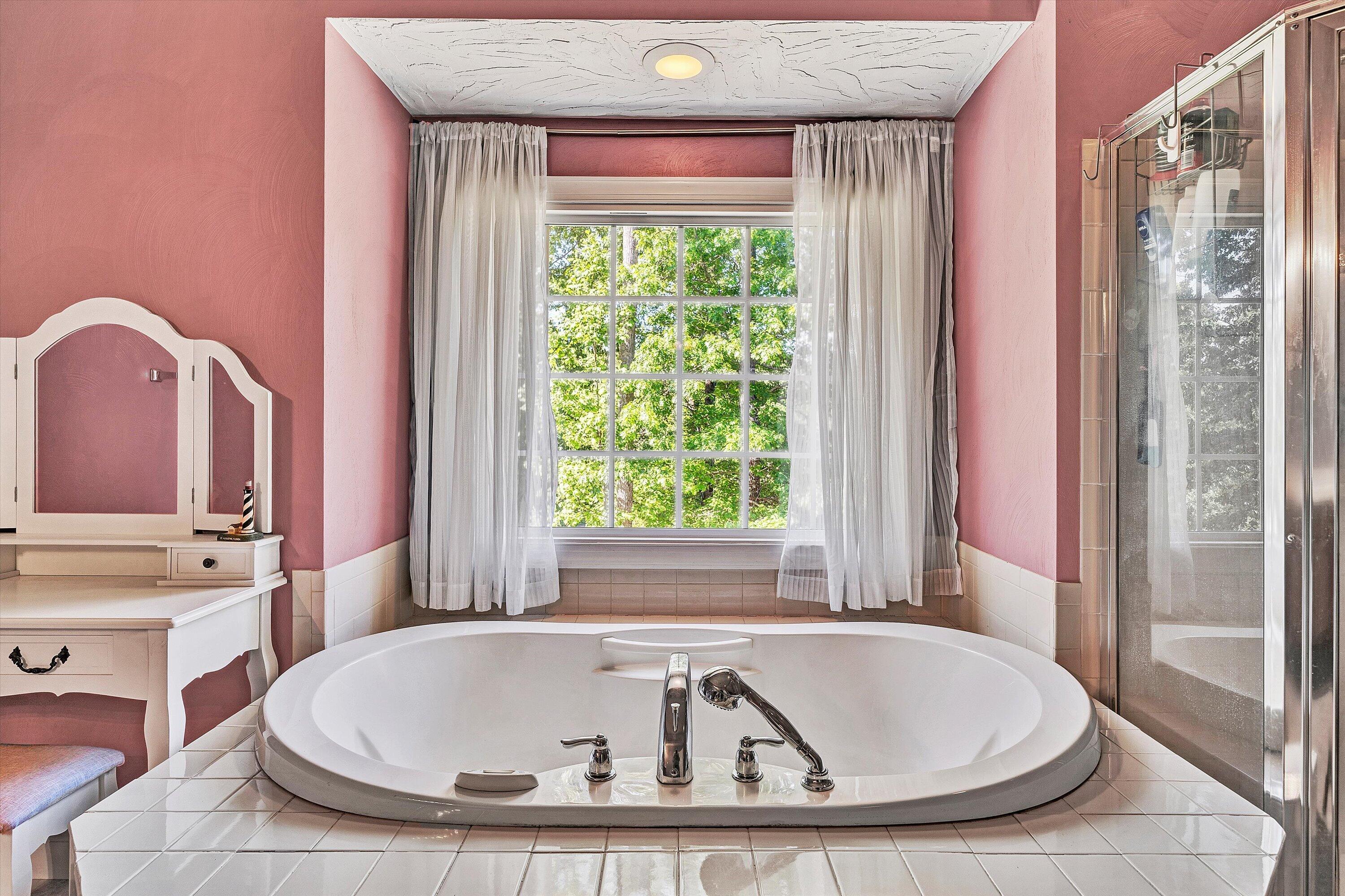 1805 Carroll Road Goodview, VA 24095 - Photo 29 of 61 a bathroom with bathtub and window