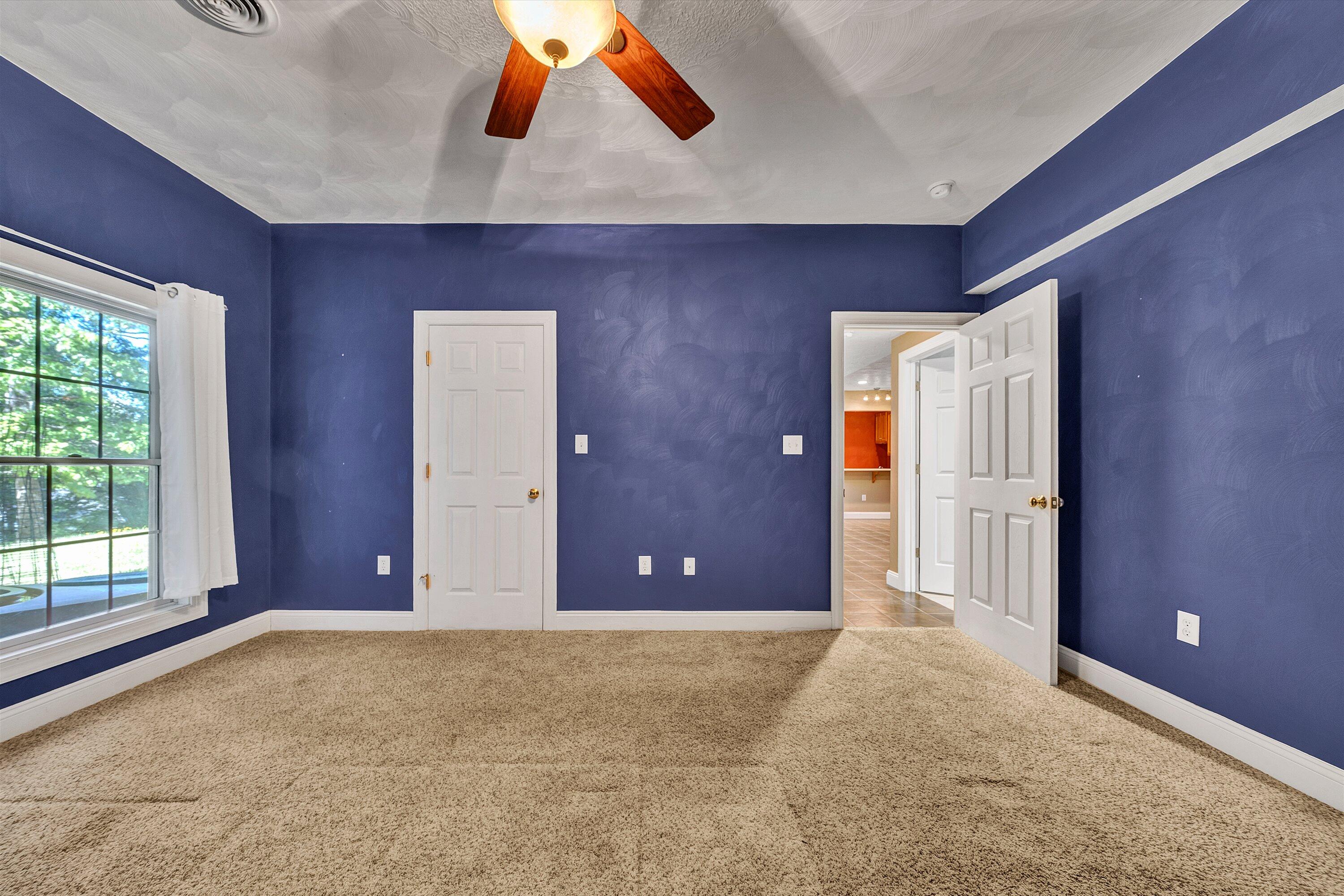 1805 Carroll Road Goodview, VA 24095 - Photo 36 of 61 an empty room with window and flowerpot