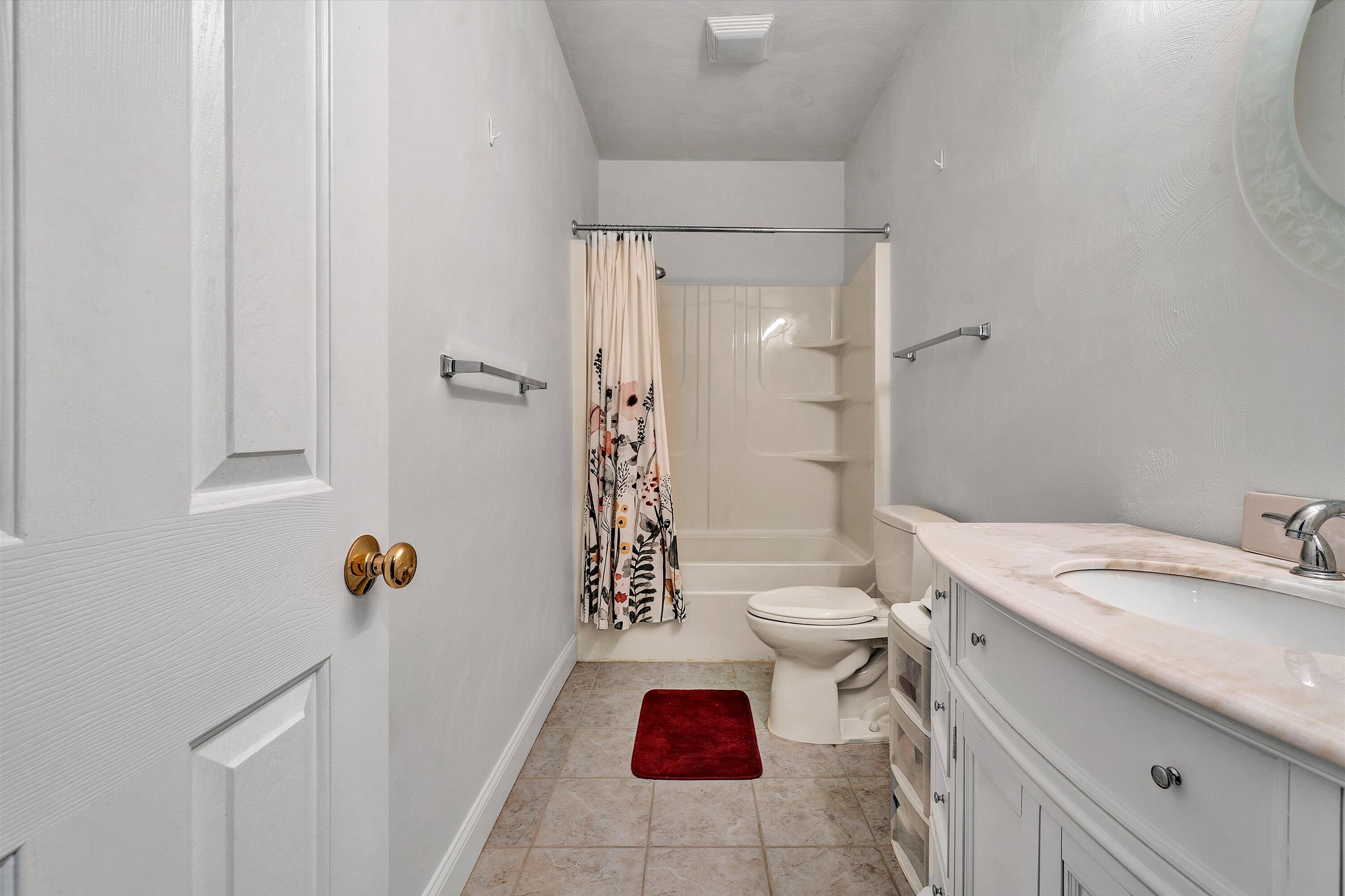 1805 Carroll Road Goodview, VA 24095 - Photo 40 of 61 a bathroom with a sink a toilet and shower