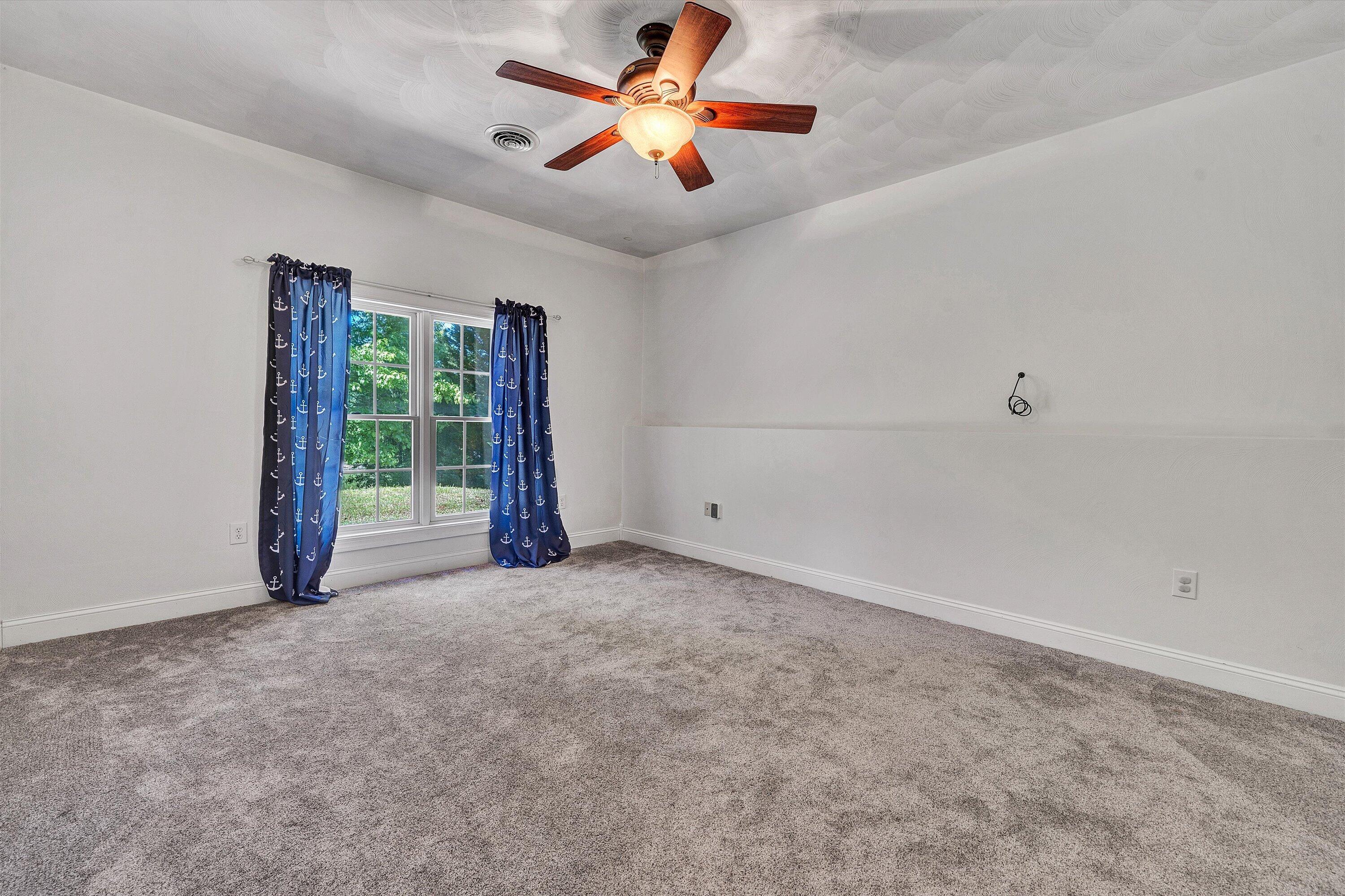 1805 Carroll Road Goodview, VA 24095 - Photo 41 of 61 wooden floor in an empty room with a window