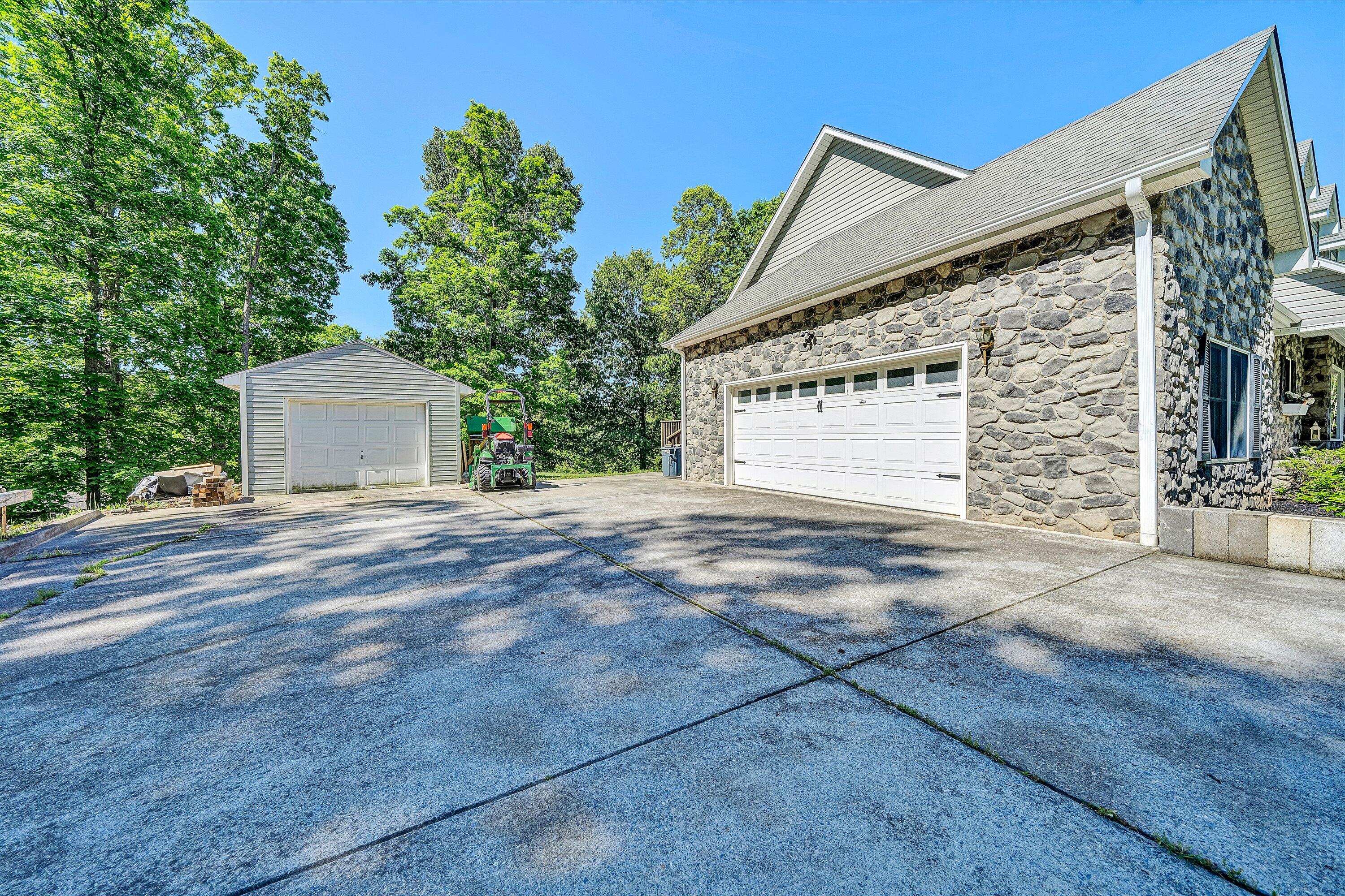 1805 Carroll Road Goodview, VA 24095 - Photo 46 of 61 a front view of a house with a yard and garage