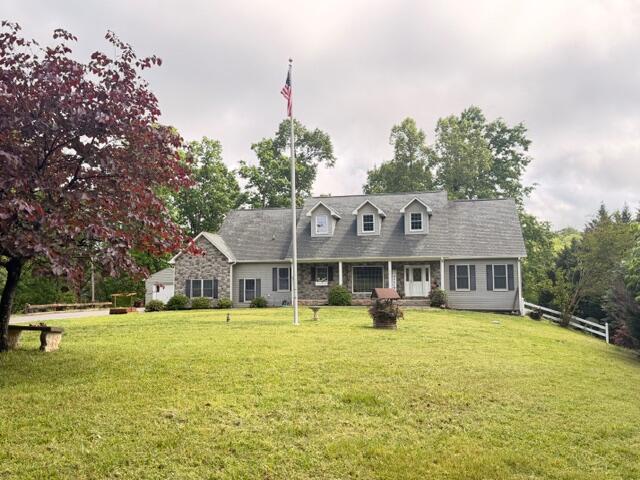 1805 Carroll Road Goodview, VA 24095 - Photo 54 of 61 a front view of house with yard and trees in the background