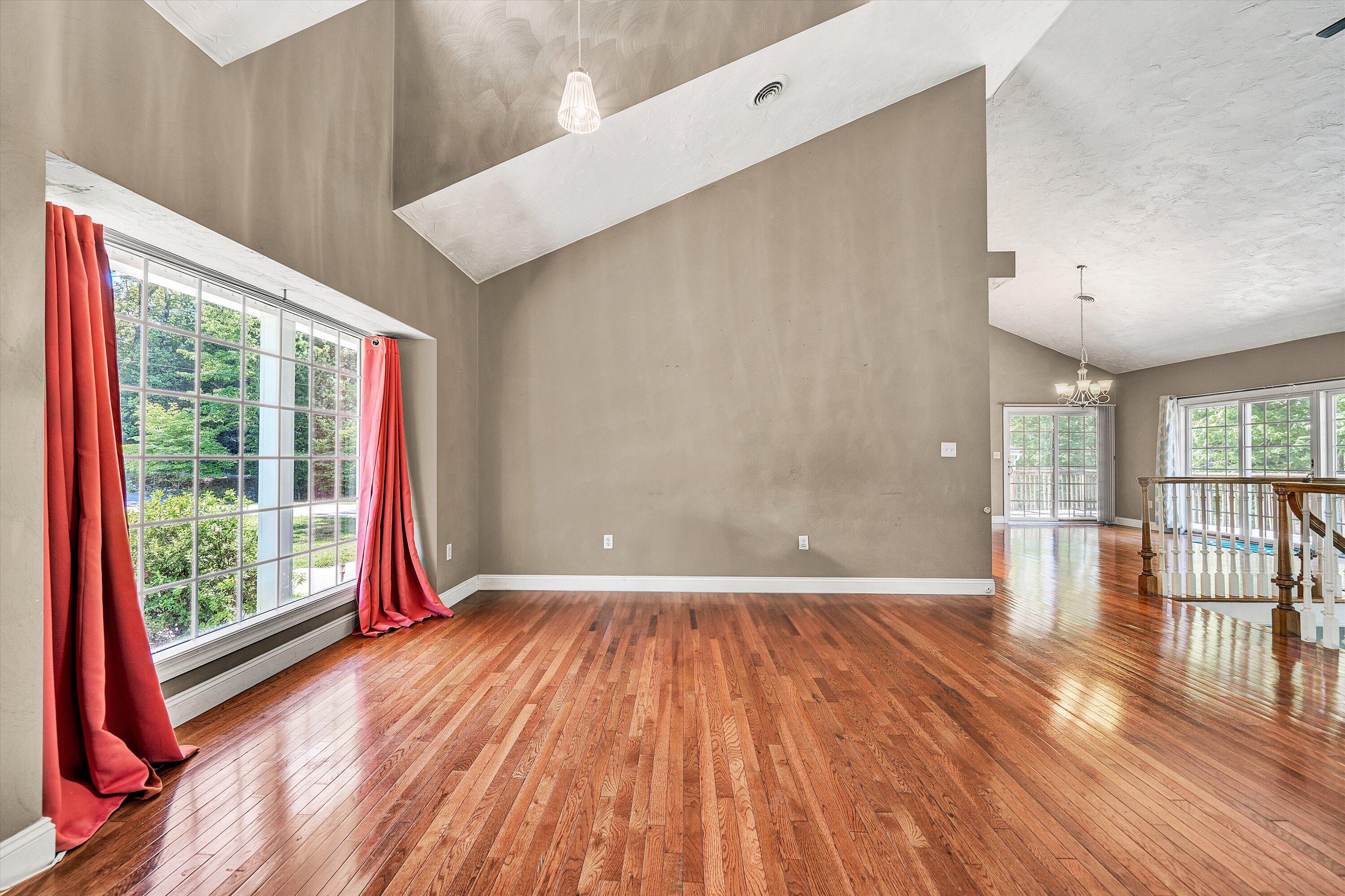 1805 Carroll Road Goodview, VA 24095 - Photo 8 of 61 a view of empty room with wooden floor and fan