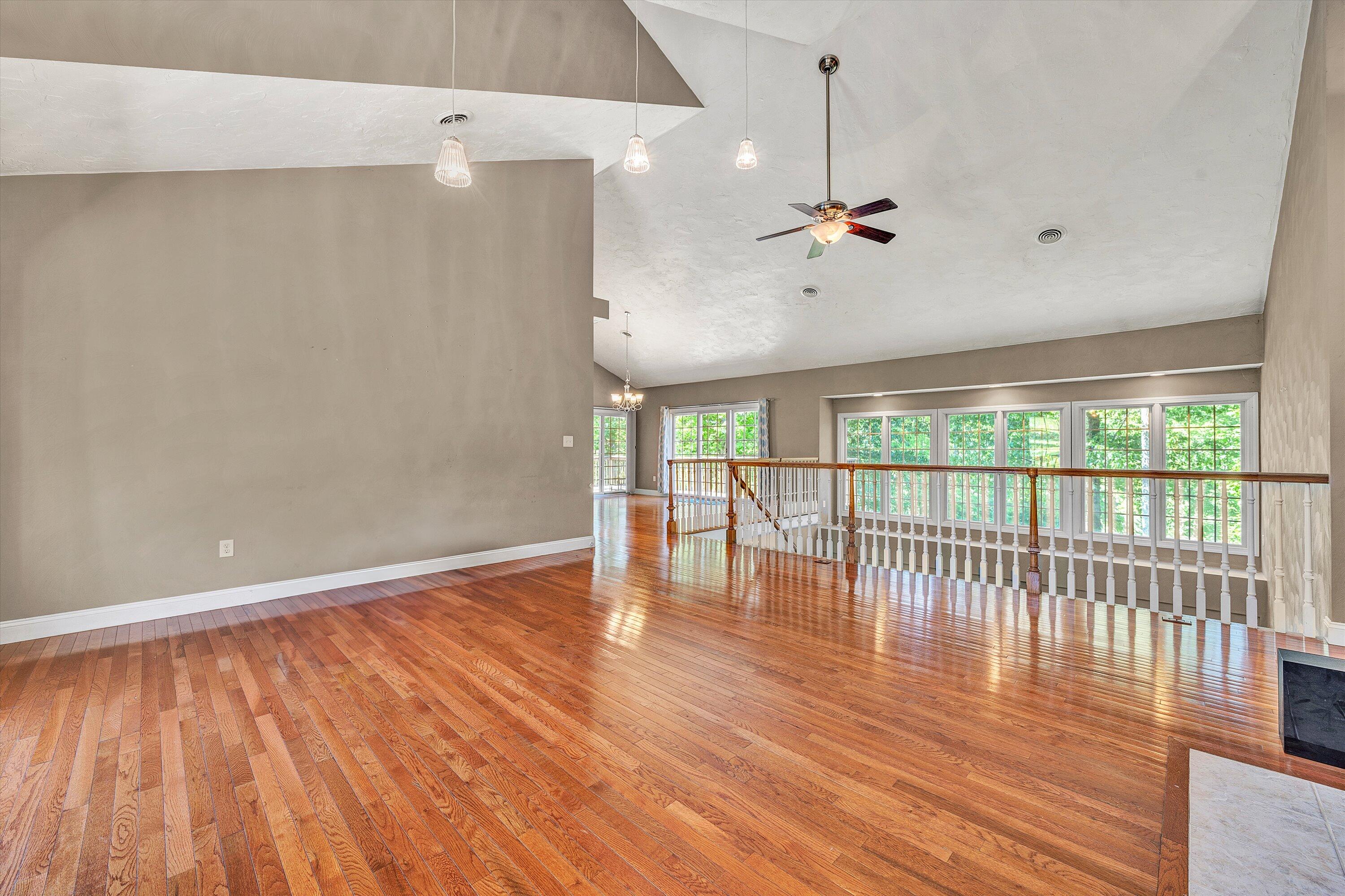 1805 Carroll Road Goodview, VA 24095 - Photo 9 of 61 a view of an empty room with wooden floor and a window