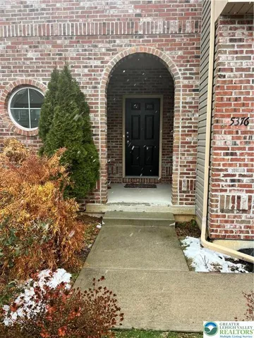 a view of yellow house with a outdoor space