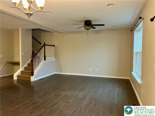 a view of an entryway with wooden floor