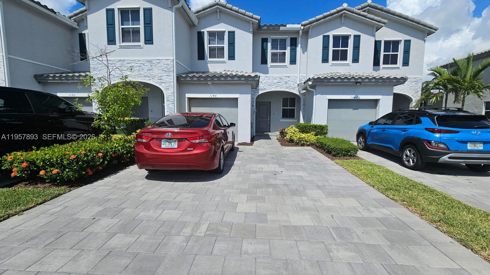 1146 Southeast 26th Street Homestead, FL 33035 - Photo 1 of 42 a house view with a garden space
