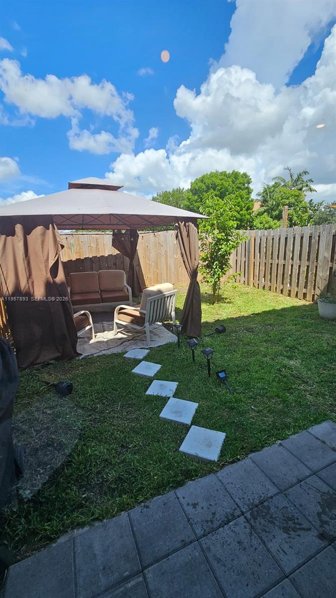 1146 Southeast 26th Street Homestead, FL 33035 - Photo 30 of 42 a view of a garden with a slide
