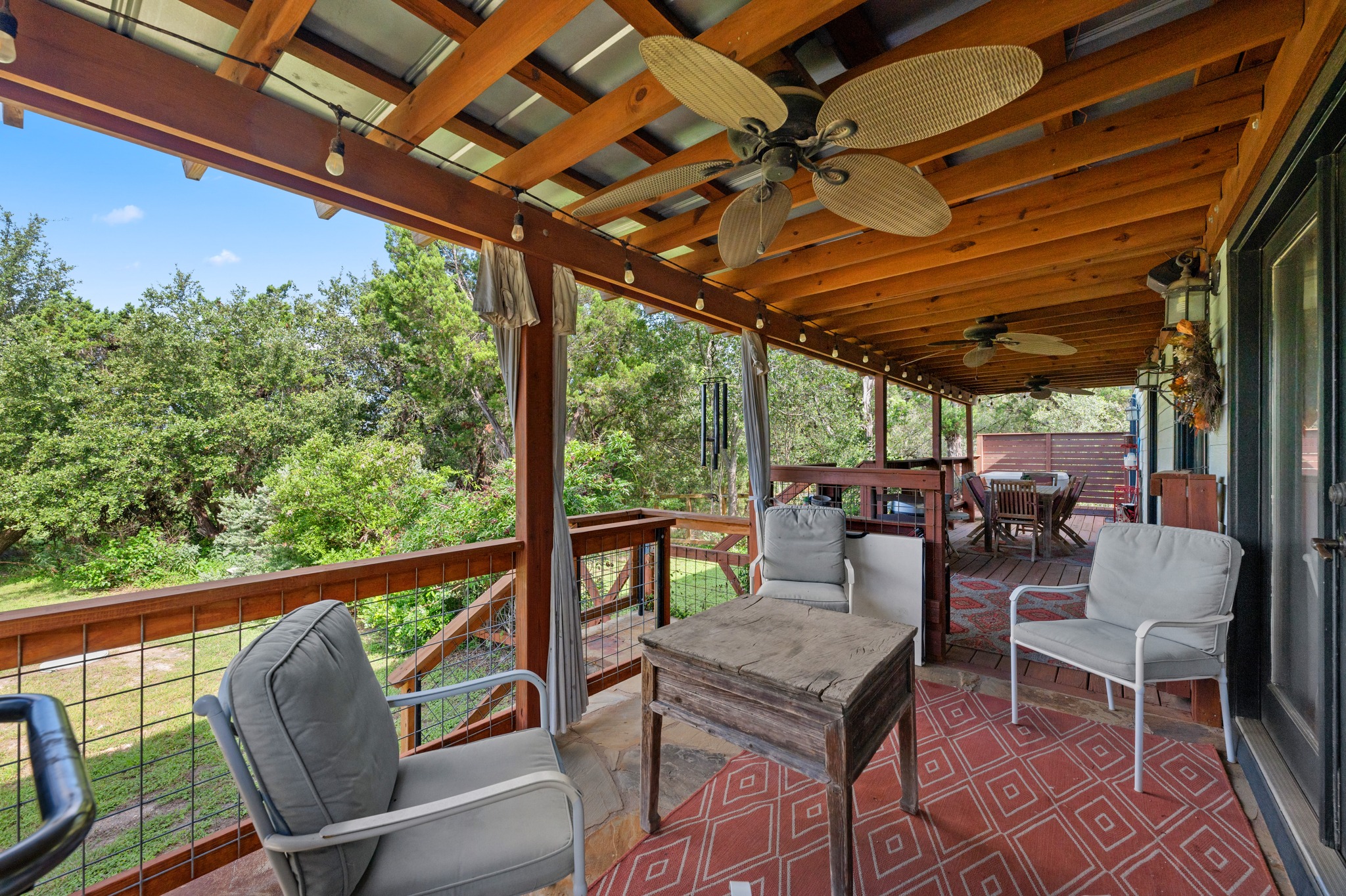 12932 Nutty Brown Road Austin, TX 78737 - Photo 14 of 40 The Cabin - Covered outdoor living area designed for entertaining and enjoying the natural surroundings.