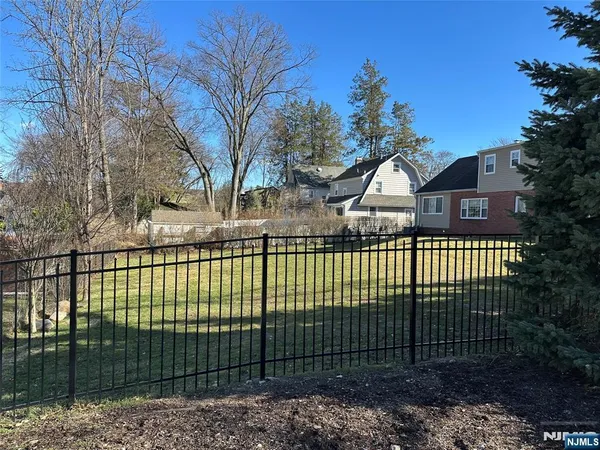 a view of a wrought iron fences in front of house