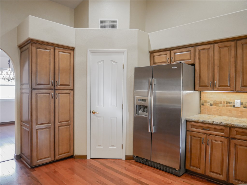 2575 Triangle S Street Kingman, AZ 86401 - Photo 12 of 45 a kitchen with stainless steel appliances granite countertop a refrigerator and a stove top oven
