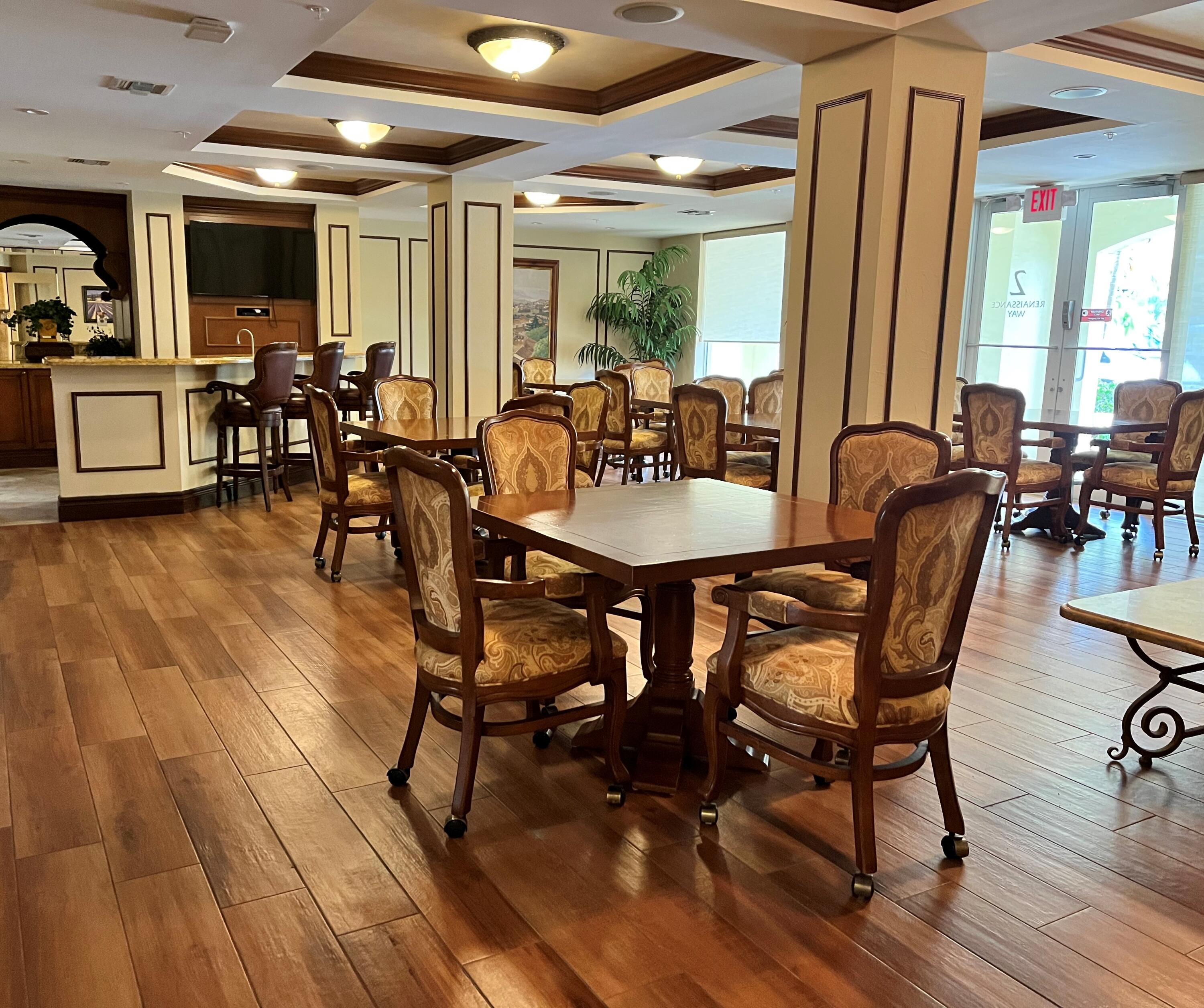 1203 Renaissance Way Boynton Beach, FL 33426 - Photo 16 of 24 a view of a dining room with furniture window and wooden floor