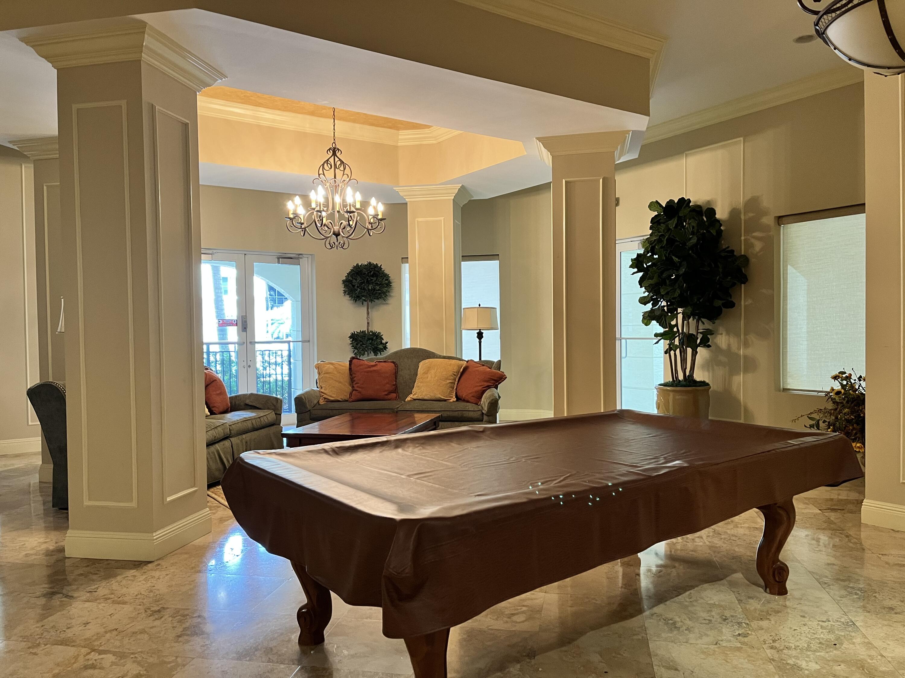 1203 Renaissance Way Boynton Beach, FL 33426 - Photo 18 of 24 a living room with dining table and chairs