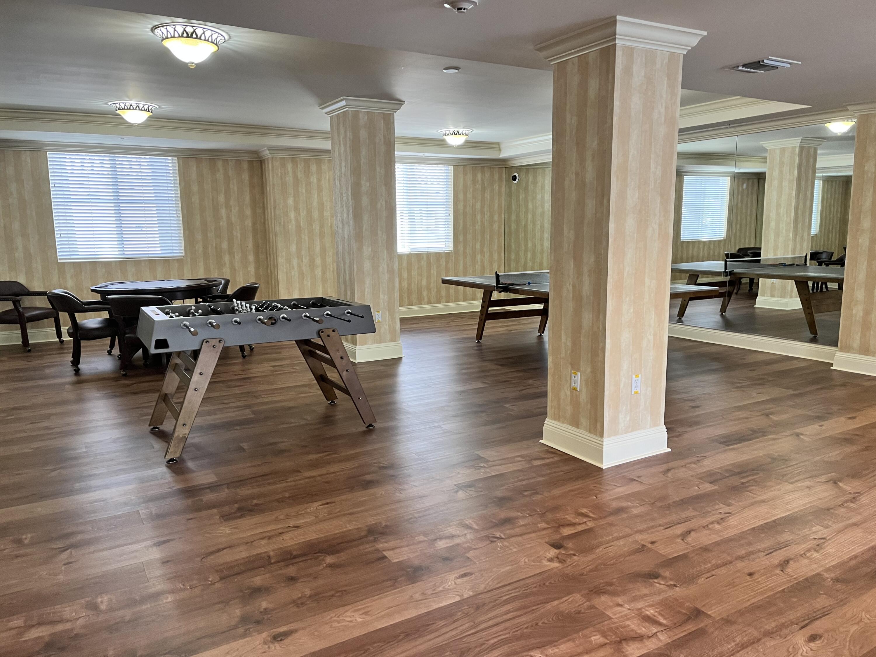 1203 Renaissance Way Boynton Beach, FL 33426 - Photo 19 of 24 a living room with fireplace furniture and a wooden floor