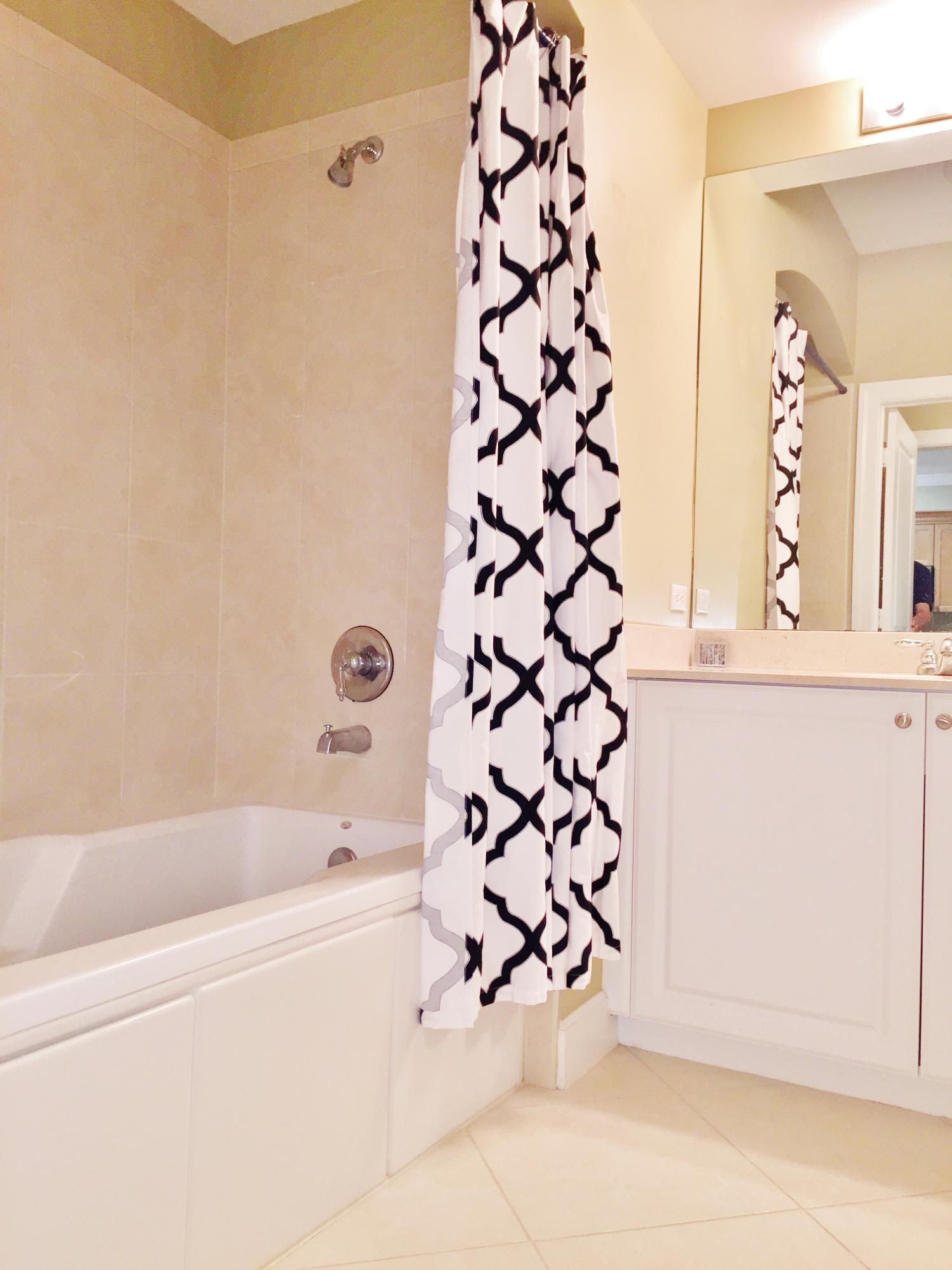 1203 Renaissance Way Boynton Beach, FL 33426 - Photo 10 of 24 a bathroom with a bathtub and shower