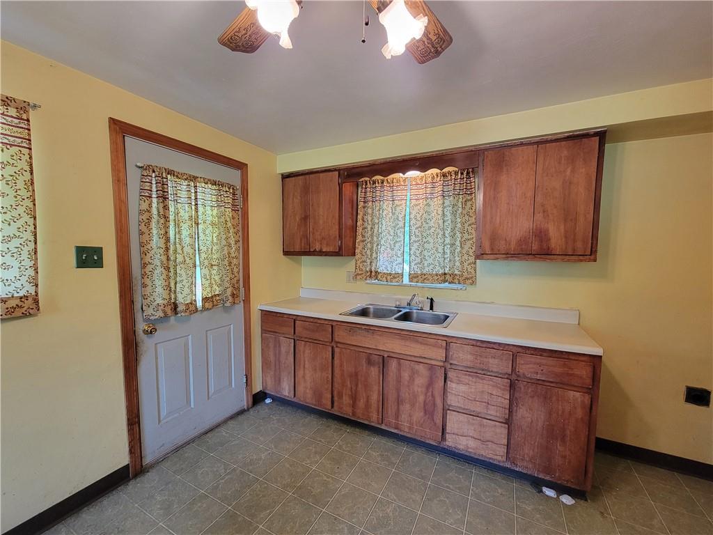 482 Gas Valley Road Georgetown, PA 15043 - Photo 3 of 10 a kitchen with sink cabinets and window