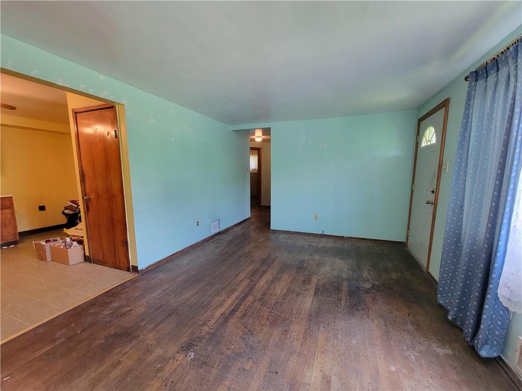 482 Gas Valley Road Georgetown, PA 15043 - Photo 5 of 10 an empty room with wooden floor and windows