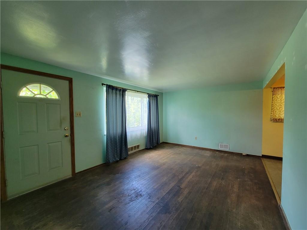 482 Gas Valley Road Georgetown, PA 15043 - Photo 7 of 10 an empty room with wooden floor and windows