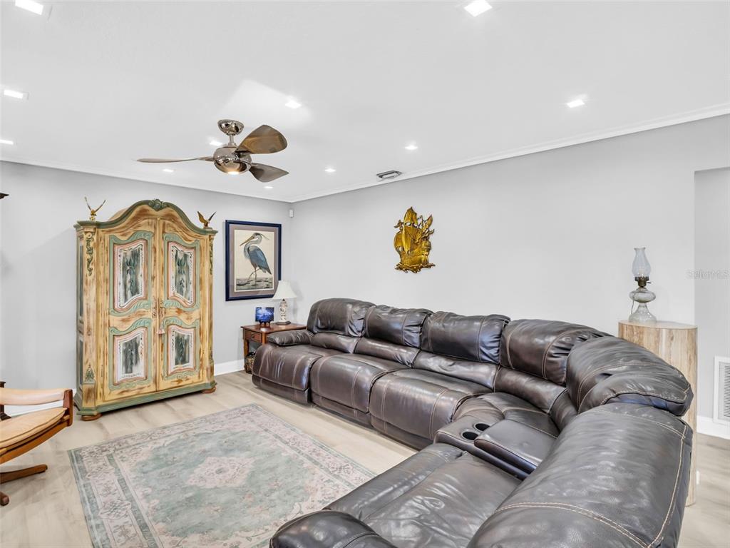 4915 S Road New Port Richey, FL 34652 - Photo 13 of 93 a living room with furniture and a window